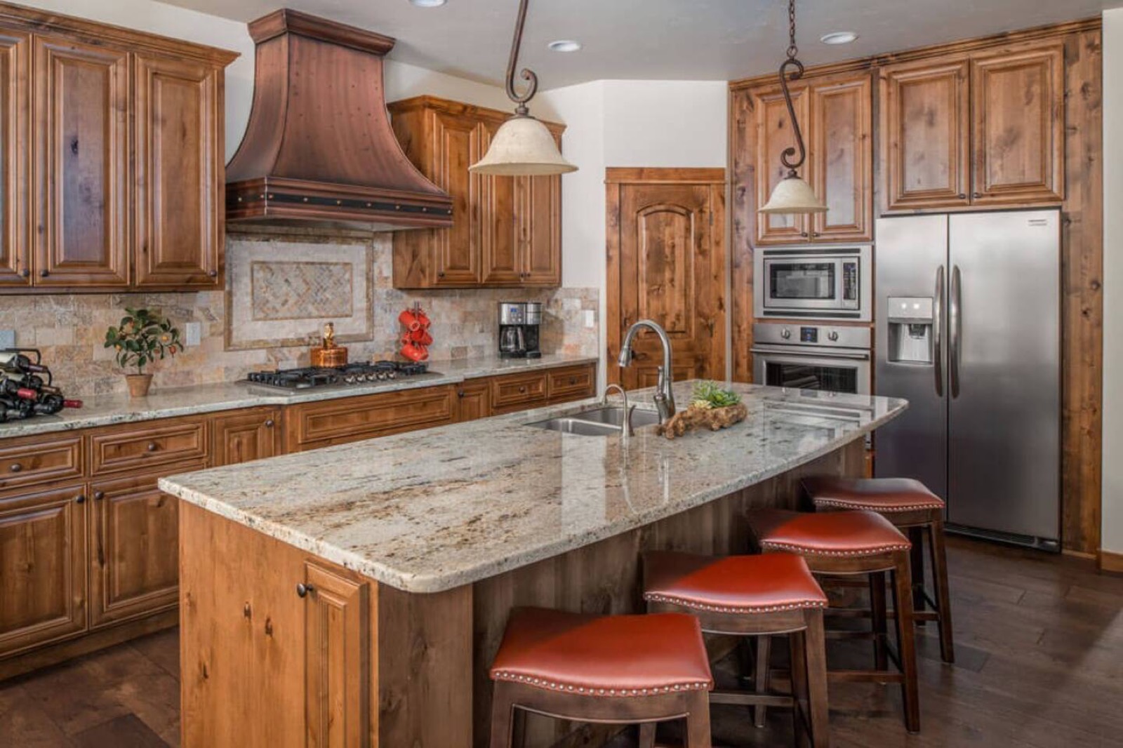 Kitchen with an island, gas range and stainless-steel appliances