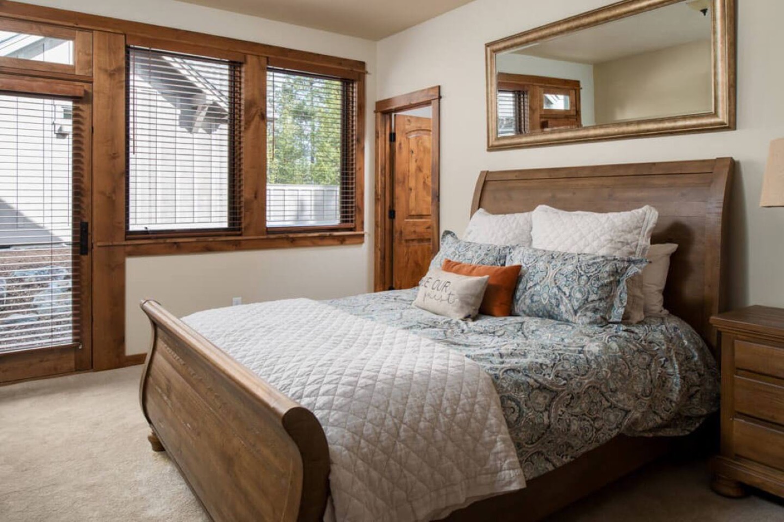Bedroom with a queen bed and separate outdoor entry