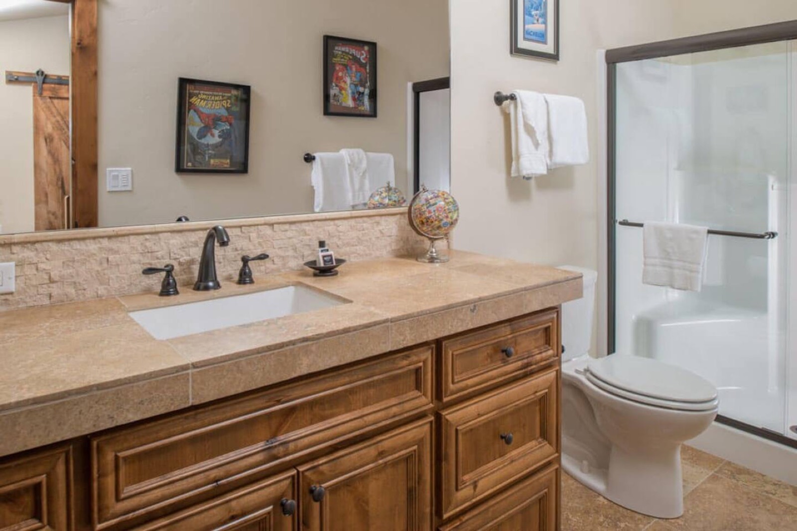 Loft bathroom with a walk-in shower and single vanity