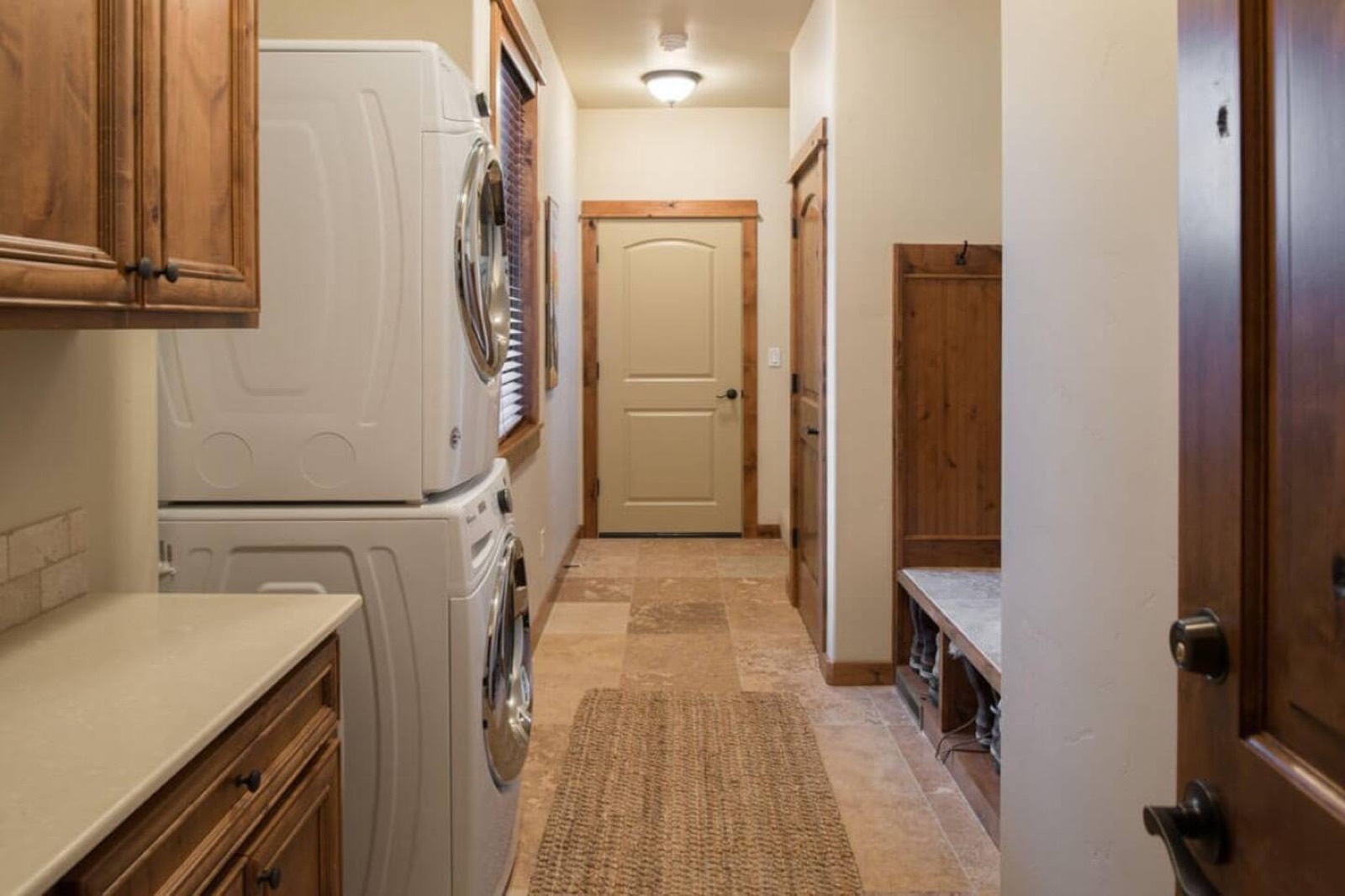 Hallway and laundry area leading to the garage game room