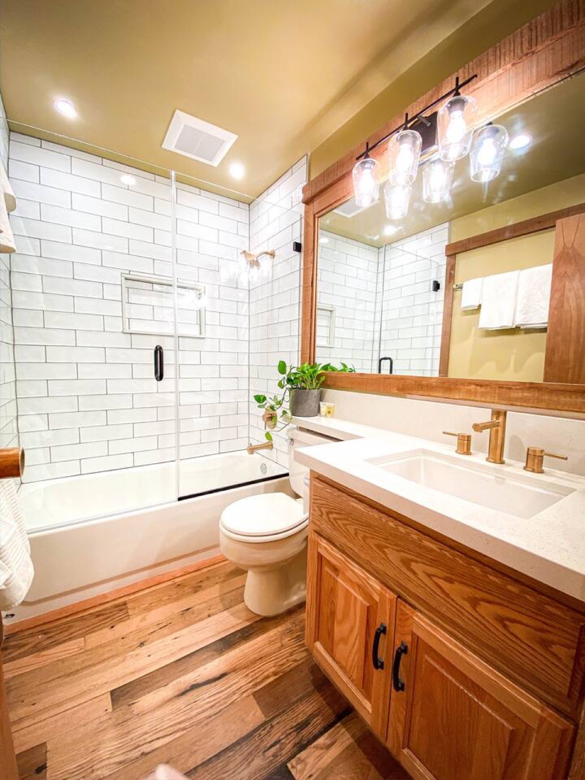 First-floor bathroom with a soaking tub and wood floor