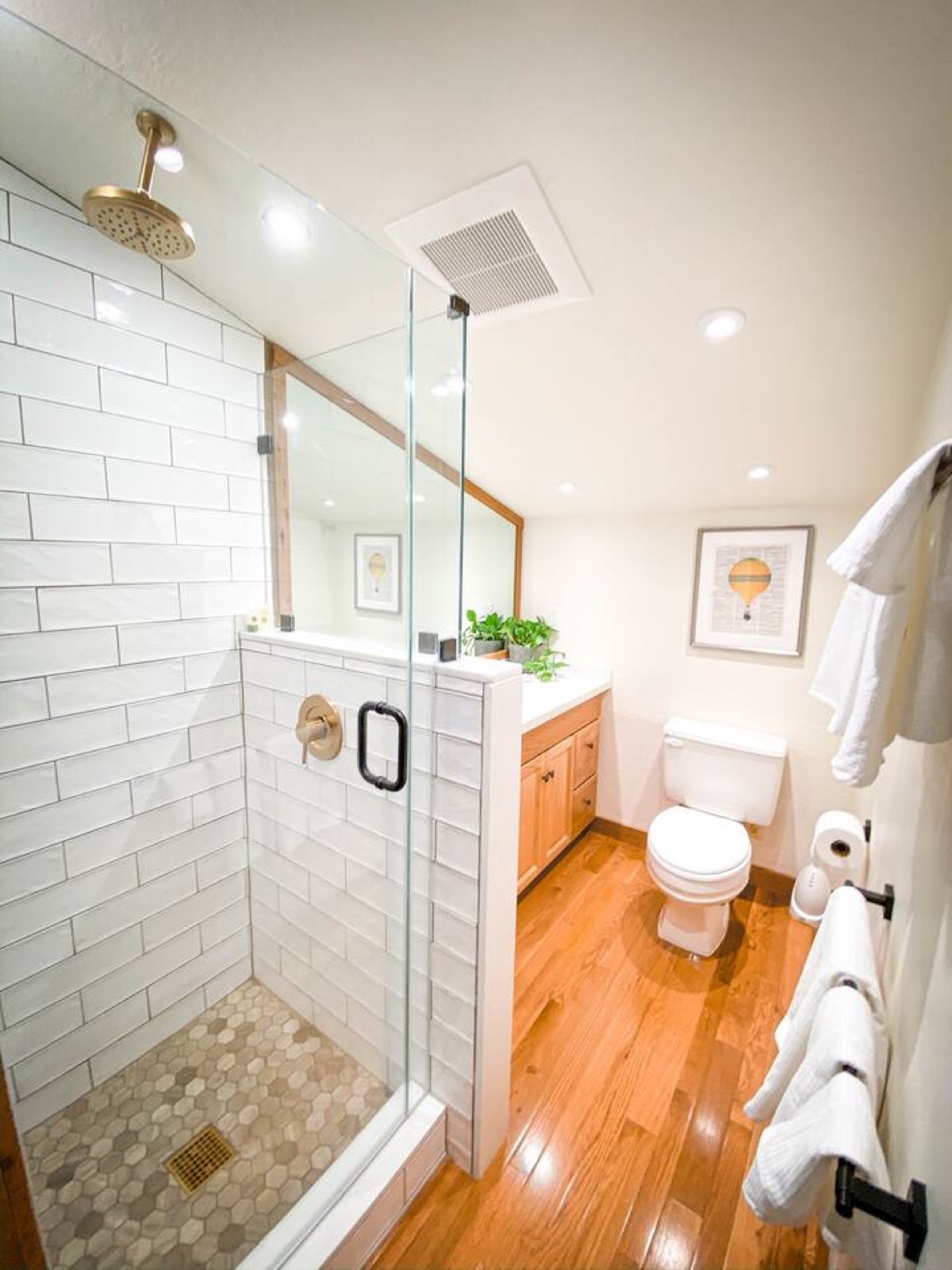 Upstairs bathroom with a rain shower and long vanity