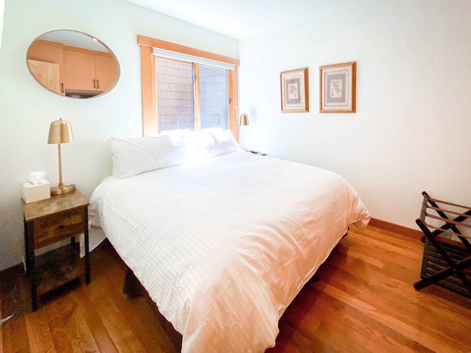 First-floor bedroom with a queen bed and television
